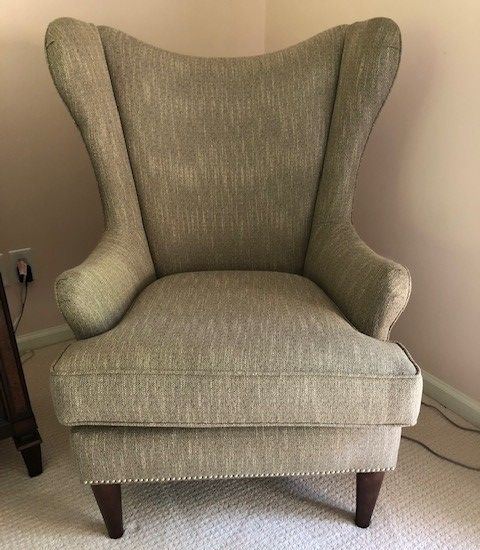 Shabby wingback chair before re-upholstering